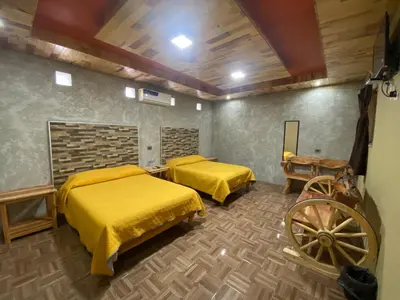 Cama o camas de una habitación en Cabañas Rochivo Ranch