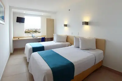 Cama o camas de una habitación en One Culiacan Forum