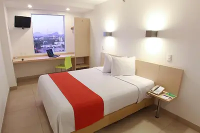 Cama o camas de una habitación en One Culiacan Forum