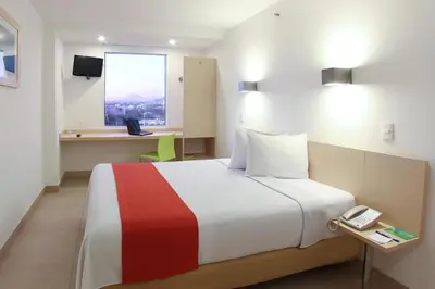 Cama o camas de una habitación en One Culiacan Forum