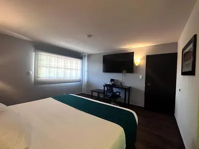 Cama o camas de una habitación en InHouse Hotel Obregón