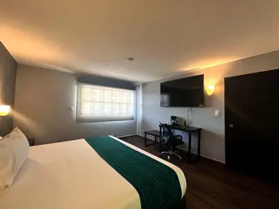 Cama o camas de una habitación en InHouse Hotel Obregón