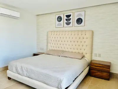 Cama o camas de una habitación en Elegante depa vista al malecón y mar by G P S rentas