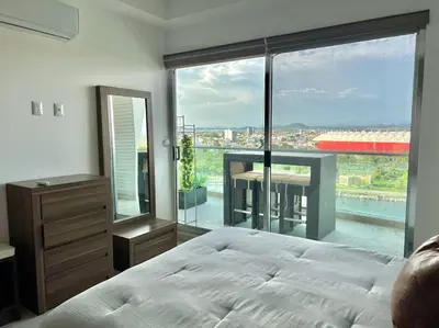 Cama o camas de una habitación en The One D12 Sobre el Malecón Vista al Estadio de Baseball