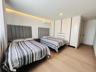 Cama o camas de una habitación en En el malecón con vistas al lago y mar by G P S rentas