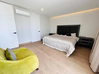 Cama o camas de una habitación en Elegante con vista al mar y malecón by G P S rentas