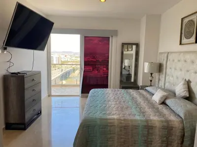 Cama o camas de una habitación en Lujoso y Exclusivo Condominio Marina Platino Plus I