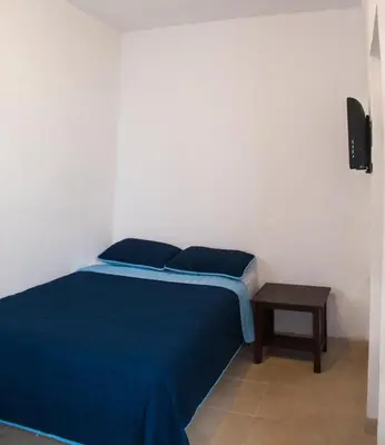 Cama o camas de una habitación en Hotel Bugambilias