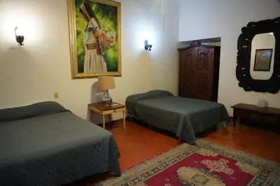 Cama o camas de una habitación en Hotel la Mansión