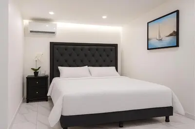 Cama o camas de una habitación en Sunset Suites Mazatlán at Lomas de Mazatlán