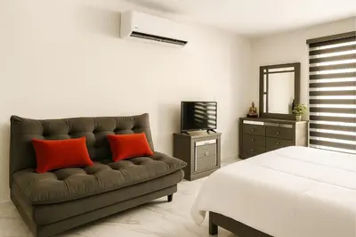 Cama o camas de una habitación en Sunset Suites Mazatlán at Lomas de Mazatlán