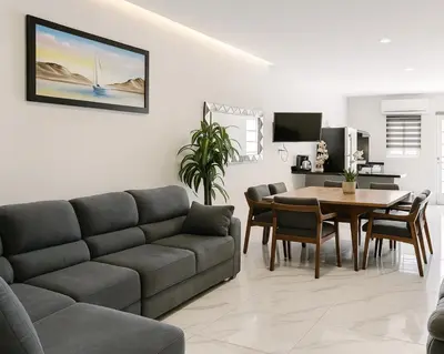 Una televisión o centro de entretenimiento en Sunset Suites Mazatlán at Lomas de Mazatlán