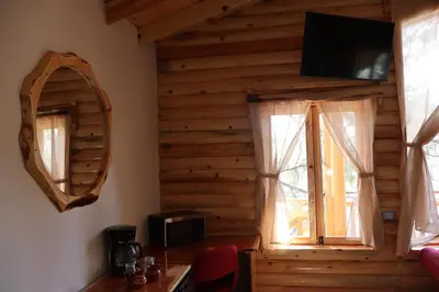 Una televisión o centro de entretenimiento en Grand Mountain Cabañas Creel