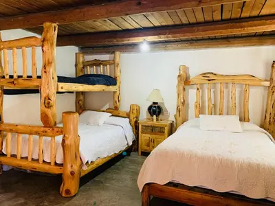 Cama o camas de una habitación en Parque Cueva de los Leones