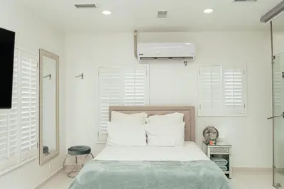 Cama o camas de una habitación en Luxury Lofts With Private Pool