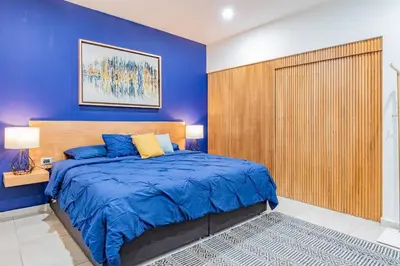Cama o camas de una habitación en LOFT El Azul en Centro Historico con Cama King