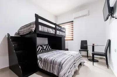 Cama o camas de una habitación en Departamento a 2 minutos de la playa by G P S rentas