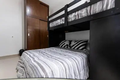 Cama o camas de una habitación en Departamento a 2 minutos de la playa by G P S rentas