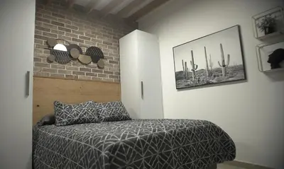 Cama o camas de una habitación en Lujoso depa cerca del consulado.