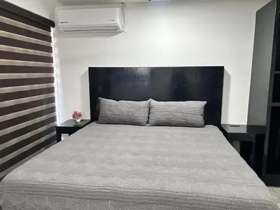 Cama o camas de una habitación en HOTEL and Suites Cananea