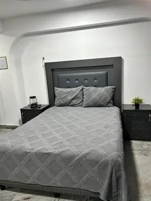 Cama o camas de una habitación en HOTEL and Suites Cananea