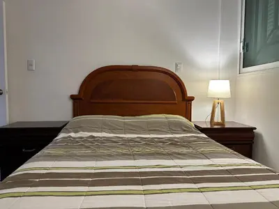 Cama o camas de una habitación en Apto comodo, muy cerca de playa 101