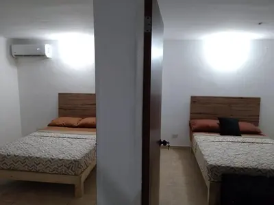 Cama o camas de una habitación en Depa Eco en planta baja, a 5 minutos del malecon y zona dorada