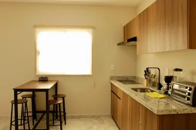 Una cocina o zona de cocina en Hotel boutique cerca de Zona Dorada by G p s rentas