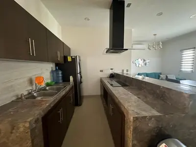 Una cocina o zona de cocina en Departamento Isla Central 1