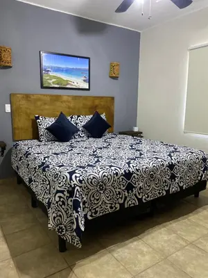 Cama o camas de una habitación en Loreto Palms Suites