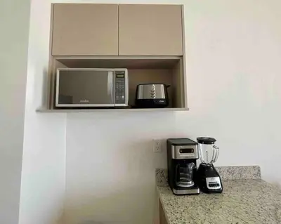 Una cocina o zona de cocina en Acogedor Departamento a Pasos De La Playa