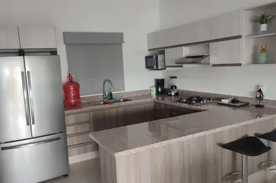 Una cocina o zona de cocina en Departamento Vacacional Forte