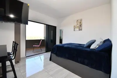 Cama o camas de una habitación en Loft de lujo con 9 albercas y vistas al campo de golf