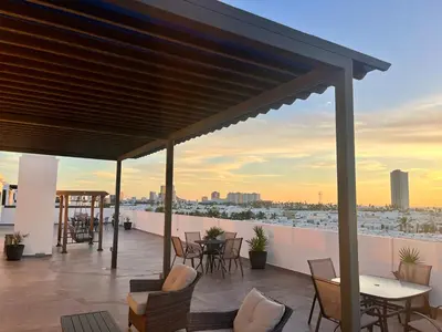 Un balcón o terraza de Loft de lujo con 9 albercas y vistas al campo de golf