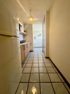 Una cocina o zona de cocina en Acogedor departamento cerca de la playa