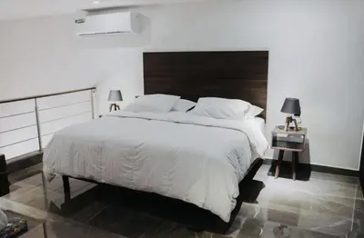 Cama o camas de una habitación en Departamentos Madero