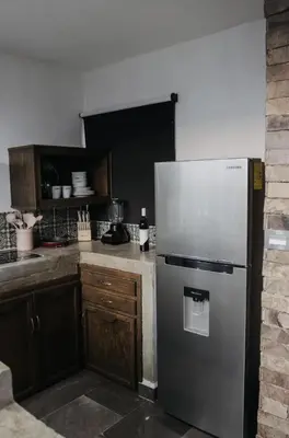 Una cocina o zona de cocina en Departamentos Madero