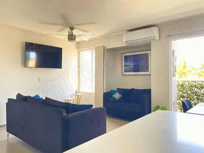 Una televisión o centro de entretenimiento en Confortable y Muy Tranquilo - Residencial Coto Mareta 14