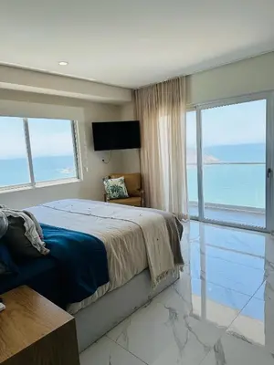 Cama o camas de una habitación en Isla Pájaros - Beach Condo