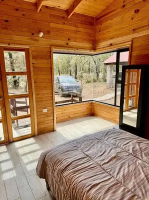 Cama o camas de una habitación en Cabaña Rincón del Bosque en Durango