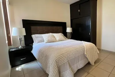 Cama o camas de una habitación en Depa en Centenario Exelente Ubicación 1!