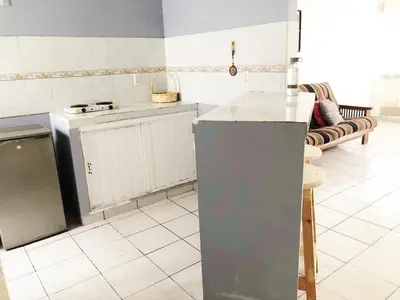 Una cocina o zona de cocina en Olímpica - Departamento Arcoíris - 5 Min Malecón