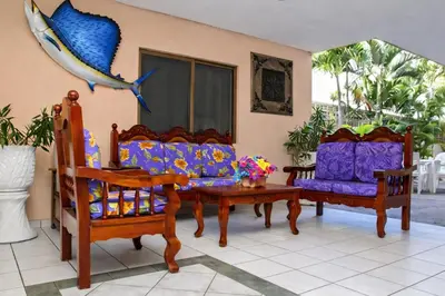 Zona de estar de Blue Pacific Suites