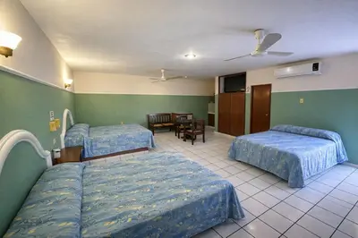 Cama o camas de una habitación en Blue Pacific Suites