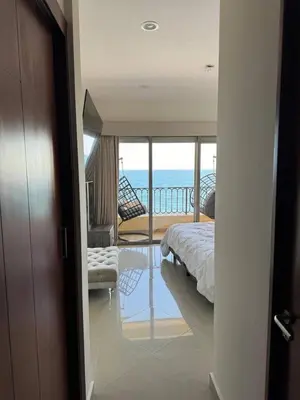 Cama o camas de una habitación en Las Gavias frente al Mar