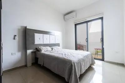 Cama o camas de una habitación en Elegante depa super céntrico en zona dorada