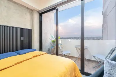 Cama o camas de una habitación en Piso 18 en Malecon con Vista al Mar
