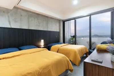 Cama o camas de una habitación en Piso 18 en Malecon con Vista al Mar