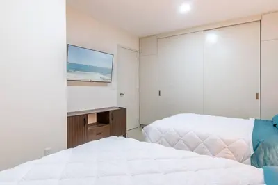 Cama o camas de una habitación en Hermoso Depa lujoso Cristal Bay Sobre el Malecon