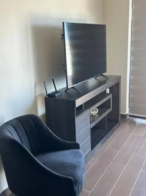 Una televisión o centro de entretenimiento en Stunning Oceanview apartment in Mazatlan